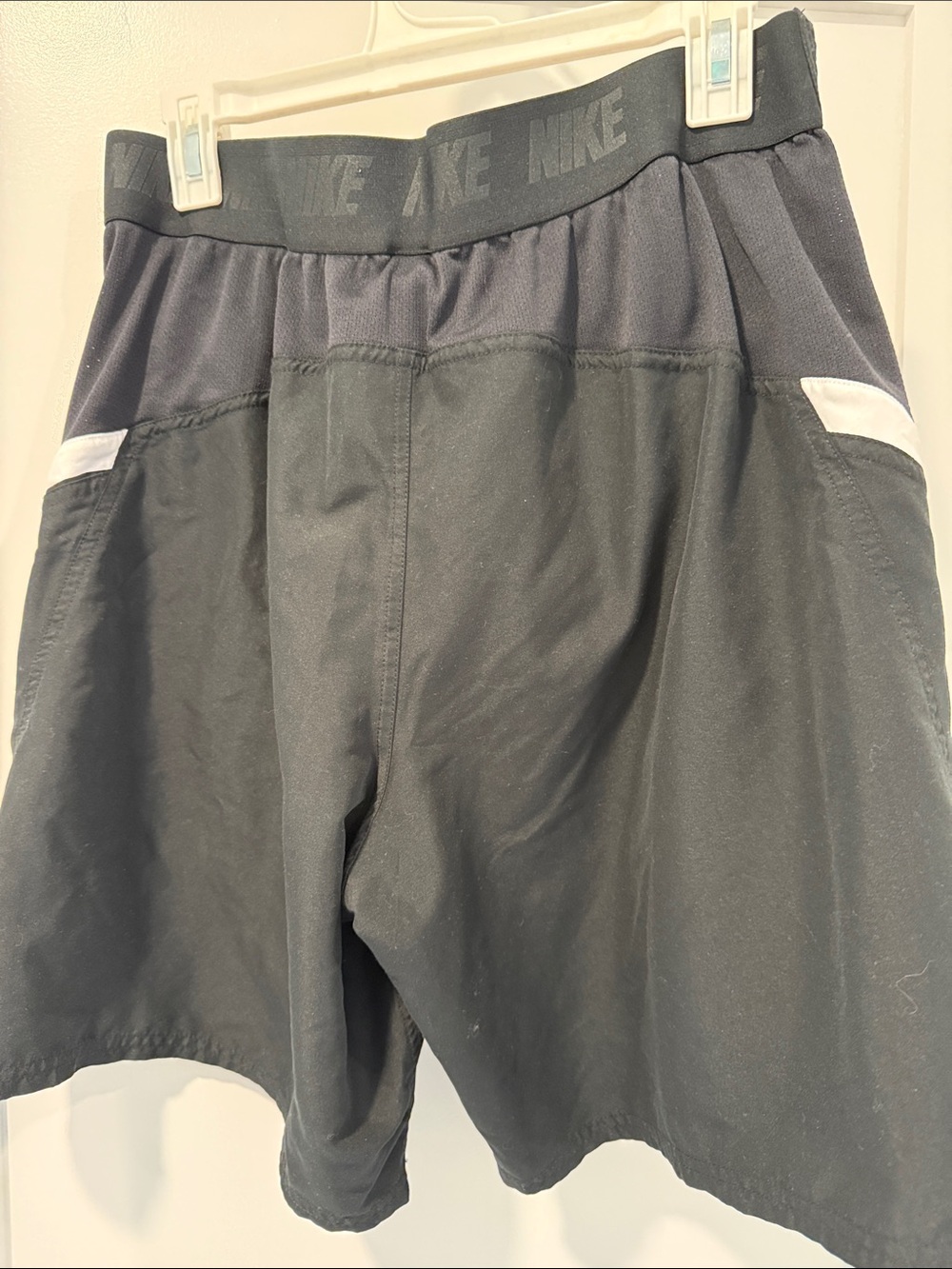 Nike Men’s Black Swim Trunks with White Pocket Accents